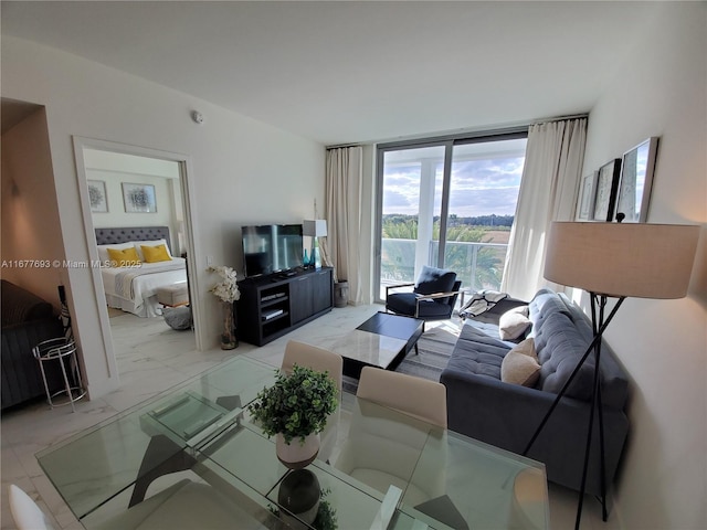 living room with marble finish floor and floor to ceiling windows