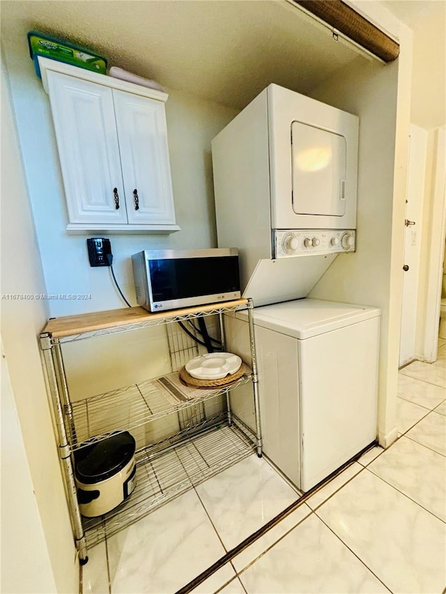 laundry room with stacked washer and dryer