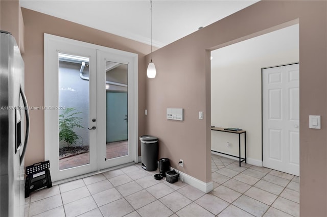 interior space featuring french doors and light tile patterned flooring