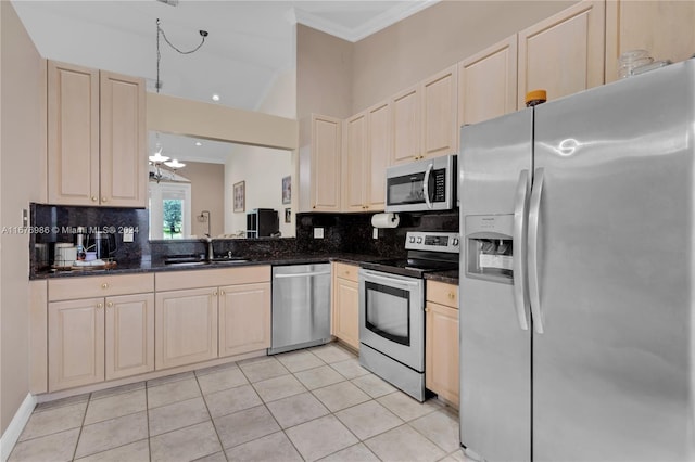 kitchen featuring stainless steel appliances, decorative backsplash, light tile patterned floors, and dark stone counters