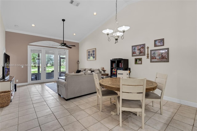 tiled dining area featuring high vaulted ceiling, crown molding, ceiling fan with notable chandelier, and french doors