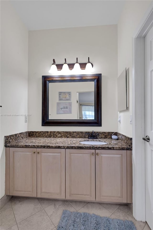 bathroom featuring vanity and tile patterned flooring