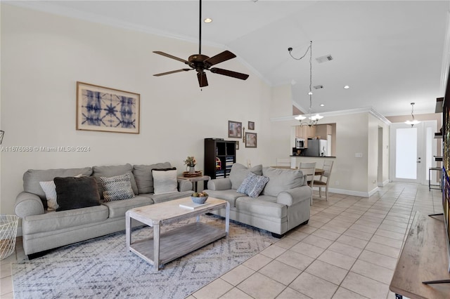 tiled living room with high vaulted ceiling, ornamental molding, and ceiling fan with notable chandelier