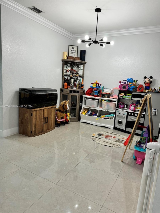 game room featuring crown molding and a chandelier