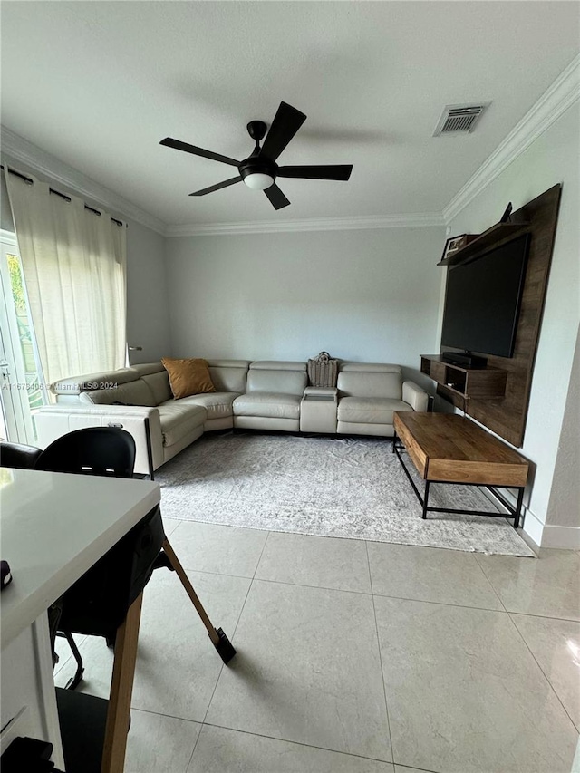 tiled living room featuring crown molding and ceiling fan