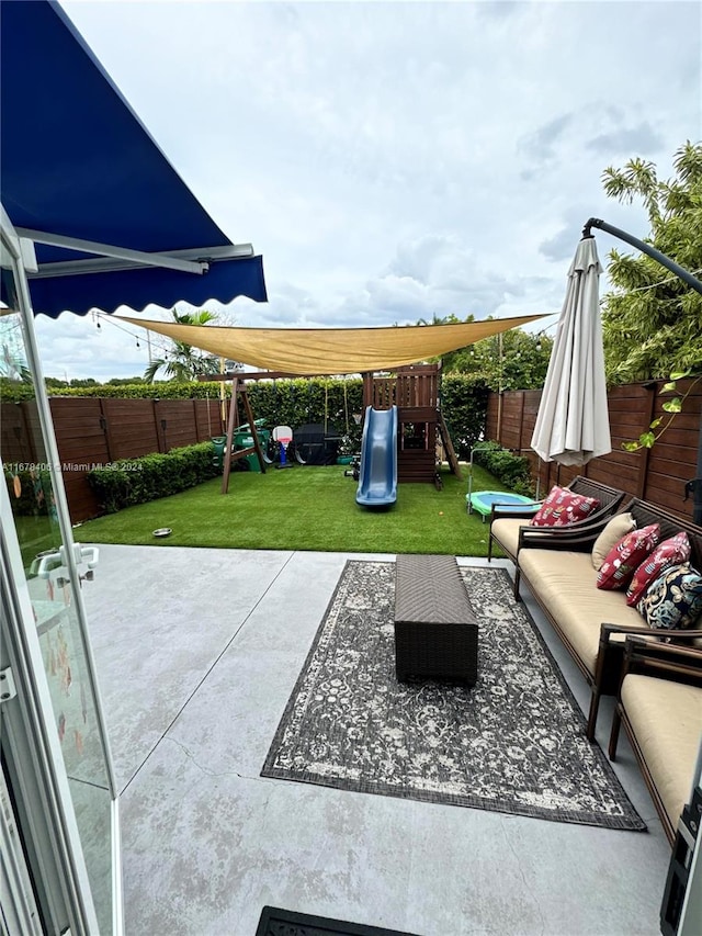 view of patio / terrace with a playground and outdoor lounge area