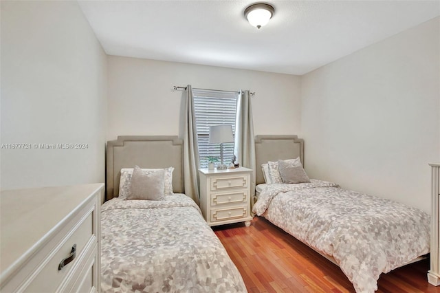 bedroom with wood-type flooring