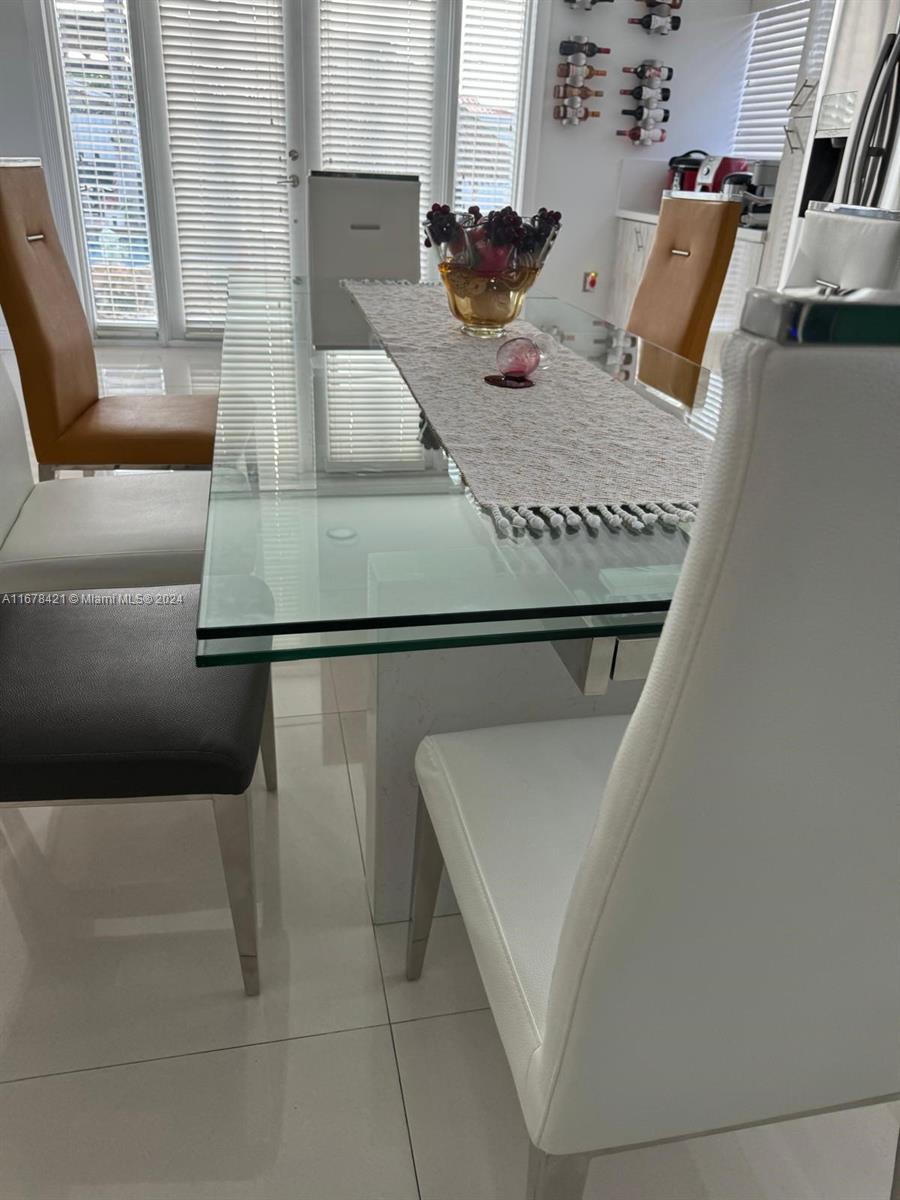 tiled dining room featuring a wealth of natural light