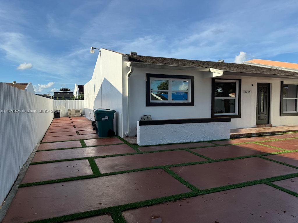 12961 SW 50th Ln Unit 1, Miami, FL 33175 - view of front facade featuring stucco siding