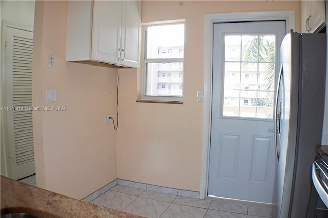 entryway featuring light tile patterned floors