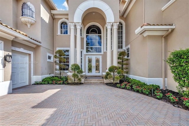 entrance to property featuring french doors