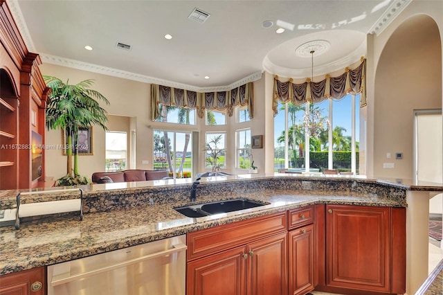 kitchen featuring dishwasher, crown molding, sink, and dark stone counters