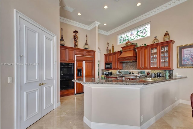 kitchen featuring stone counters, kitchen peninsula, crown molding, decorative backsplash, and black appliances