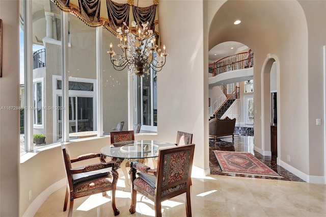 dining space with an inviting chandelier