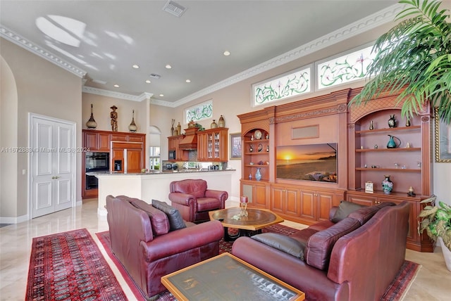 living room featuring light tile patterned floors, a wealth of natural light, and ornamental molding