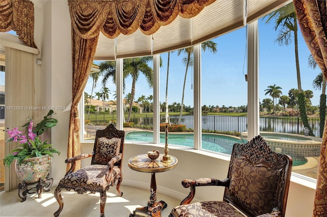 sunroom with a healthy amount of sunlight and a water view