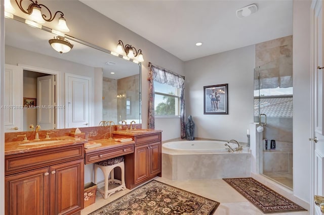 bathroom with tile patterned flooring, vanity, and independent shower and bath