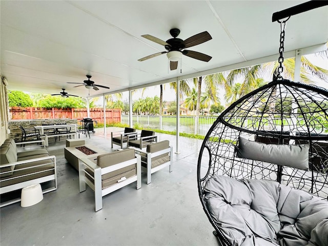 view of patio / terrace featuring an outdoor living space with a fire pit