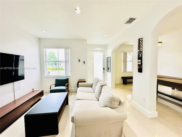 living room with light tile patterned floors