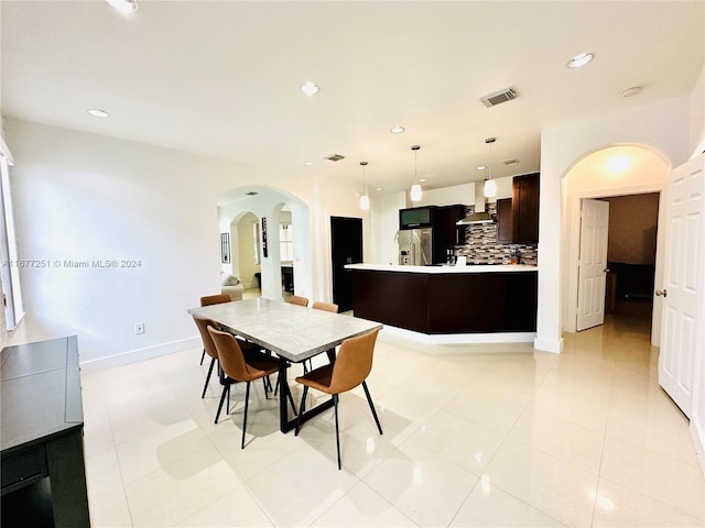 dining area featuring light tile patterned floors