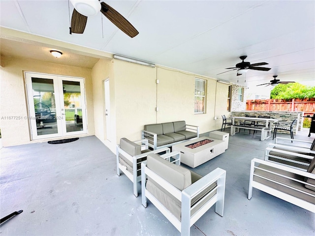 view of patio / terrace with an outdoor fire pit and french doors