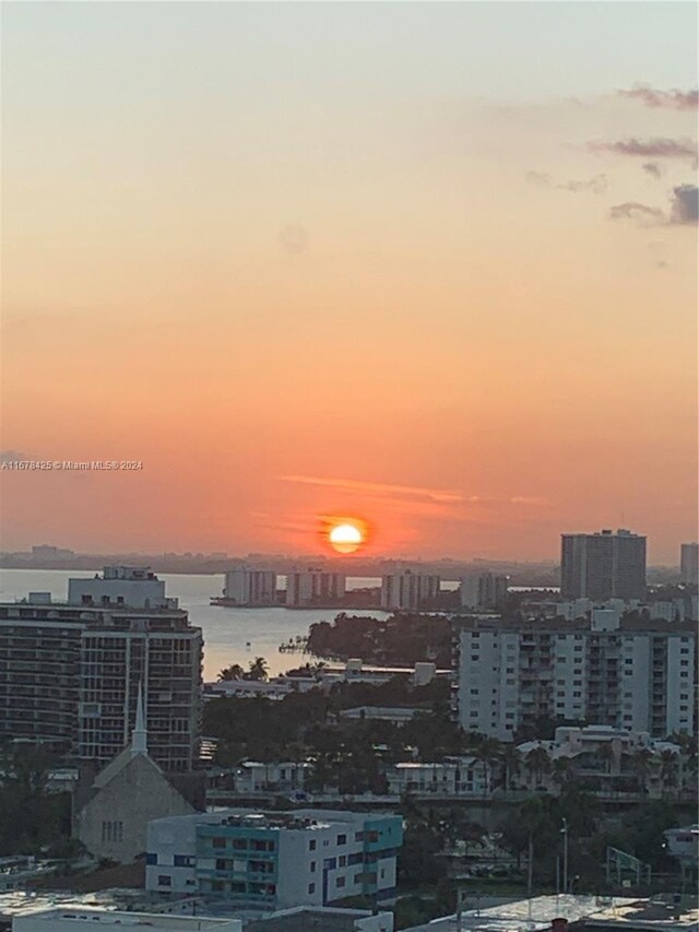 property's view of city featuring a water view