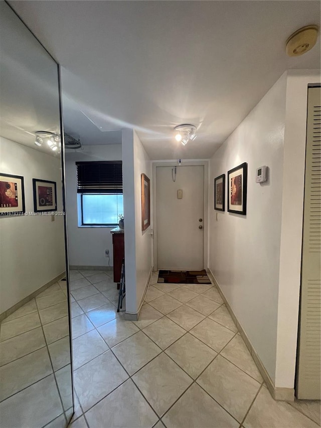 hallway with light tile patterned flooring