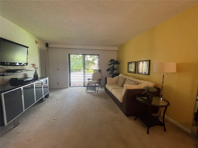 carpeted living room featuring a textured ceiling