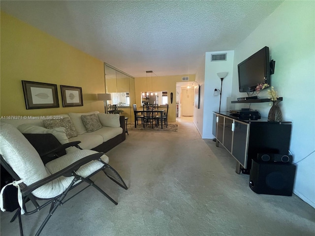 carpeted living room featuring a textured ceiling