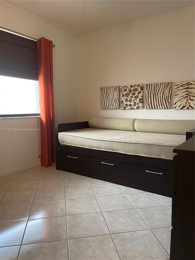 interior space featuring light tile patterned flooring