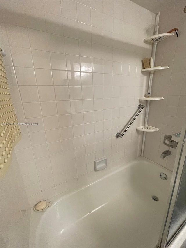 bathroom with shower / washtub combination