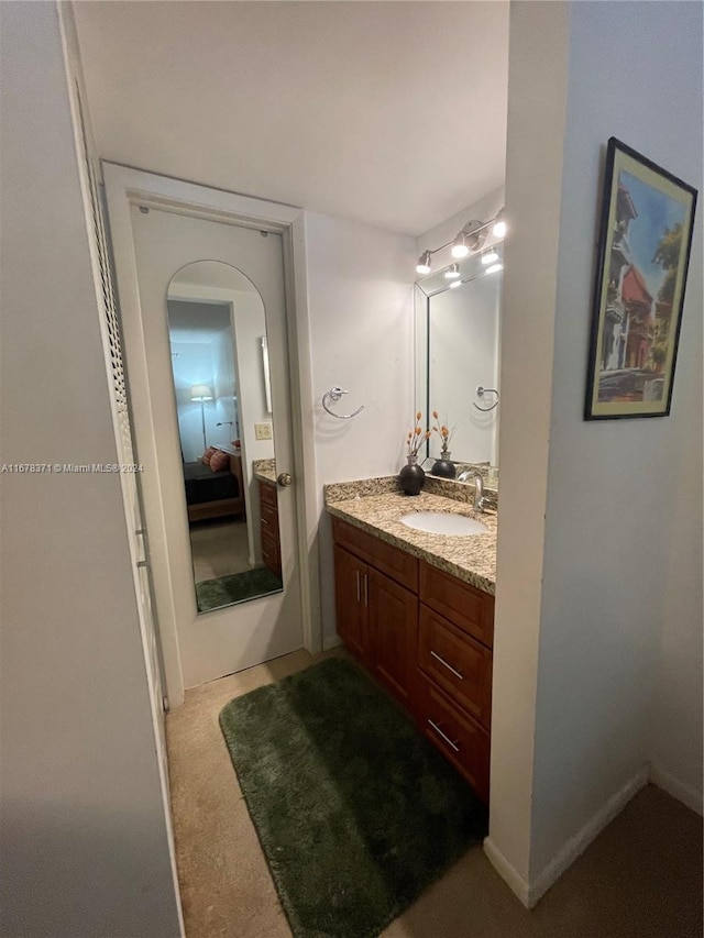 bathroom featuring connected bathroom and vanity