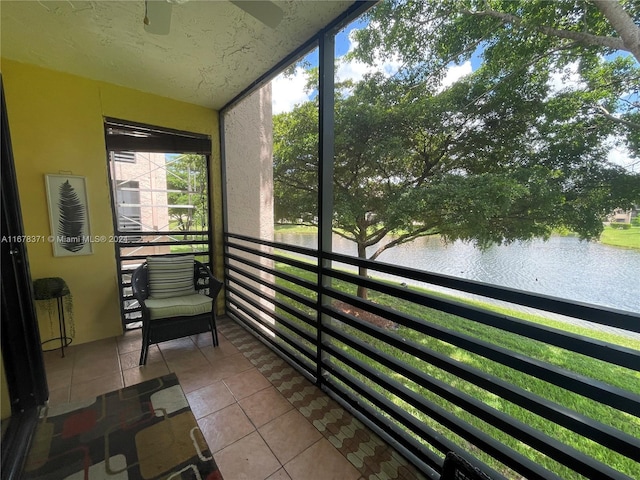 sunroom / solarium with a water view