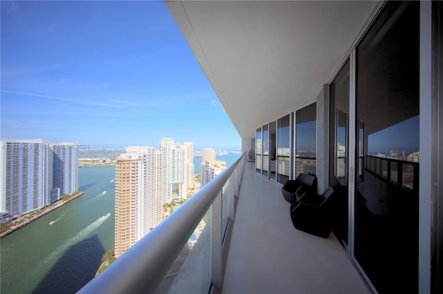 balcony featuring a water view