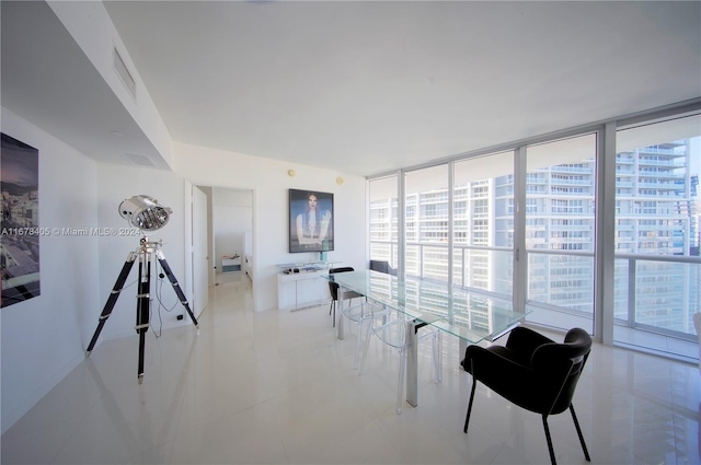 interior space with light tile patterned floors and floor to ceiling windows