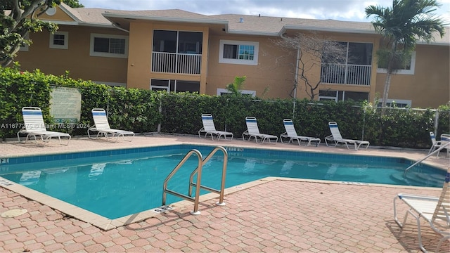 view of pool with a patio area