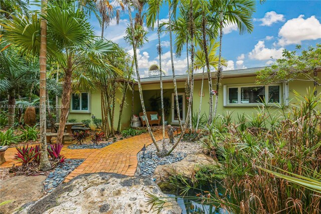 back of house with a patio