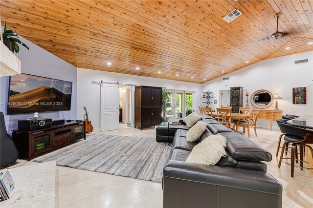 living room with wood ceiling, a barn door, high vaulted ceiling, and light tile patterned floors