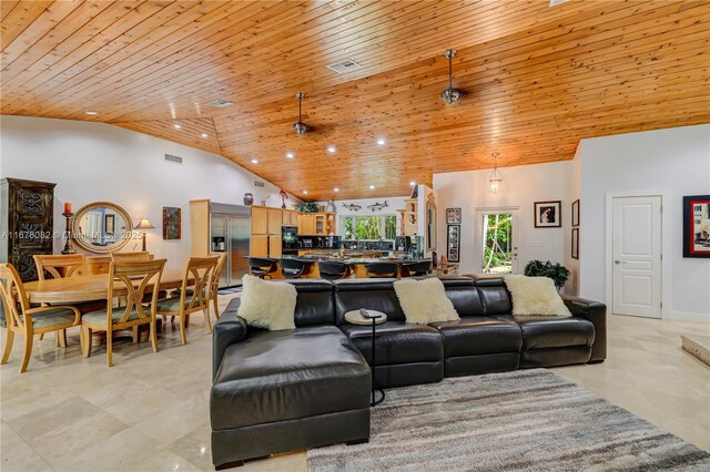 dining area with wood ceiling and high vaulted ceiling