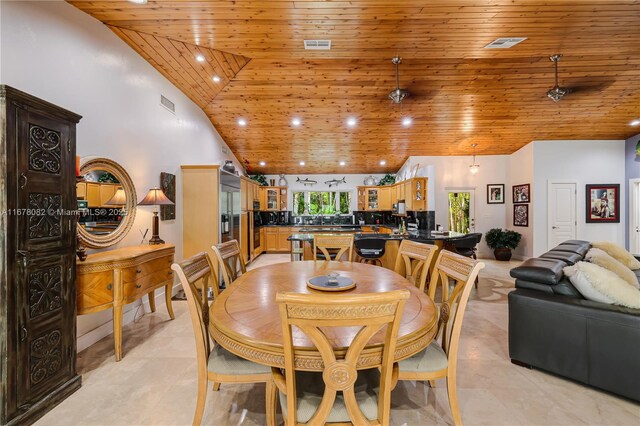 tiled dining room featuring high vaulted ceiling and wood ceiling