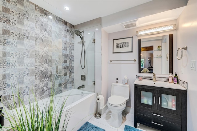 full bathroom with shower / bath combination with glass door, tile patterned floors, vanity, and toilet