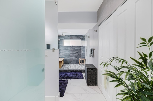 bathroom featuring a tile shower