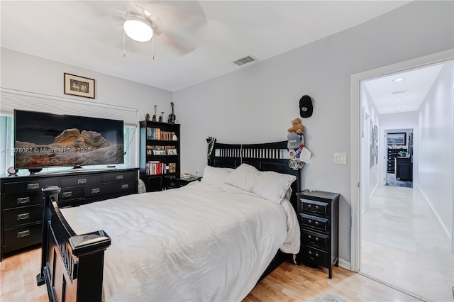 bedroom featuring ceiling fan and light hardwood / wood-style floors