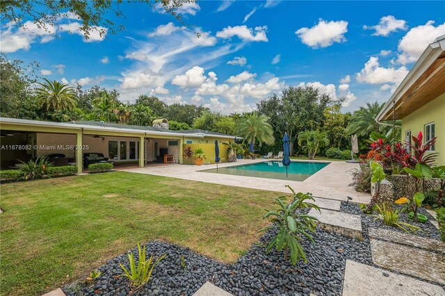 view of swimming pool with a patio area