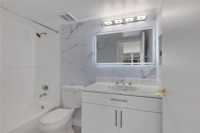 full bathroom with vanity, toilet, and shower / washtub combination