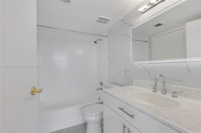 full bathroom with toilet, tiled shower / bath combo, tasteful backsplash, and vanity