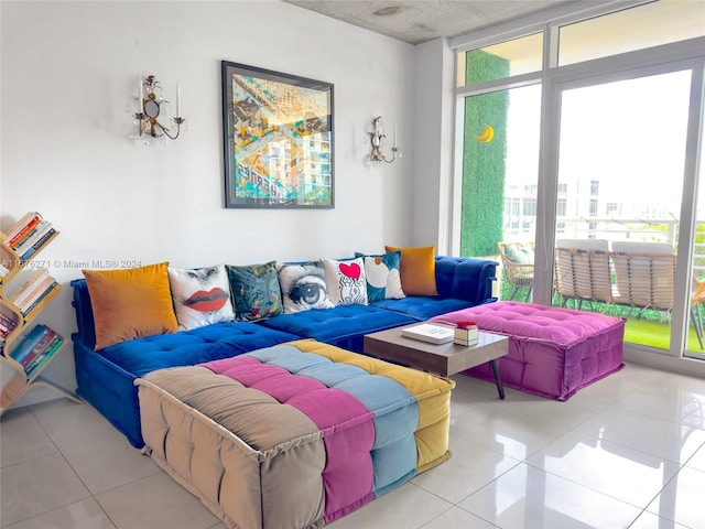 living room featuring expansive windows and light tile patterned floors