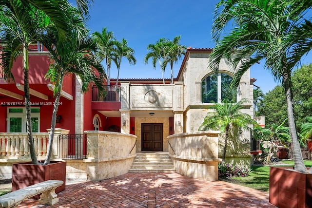 mediterranean / spanish house with a balcony