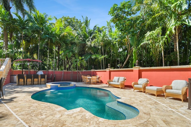 view of swimming pool featuring an in ground hot tub and a patio