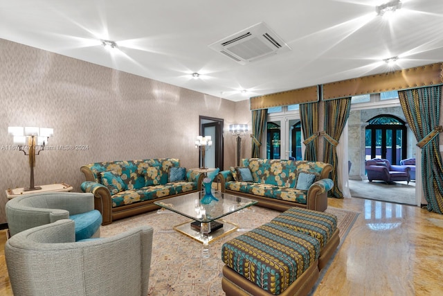 living room featuring concrete floors and french doors